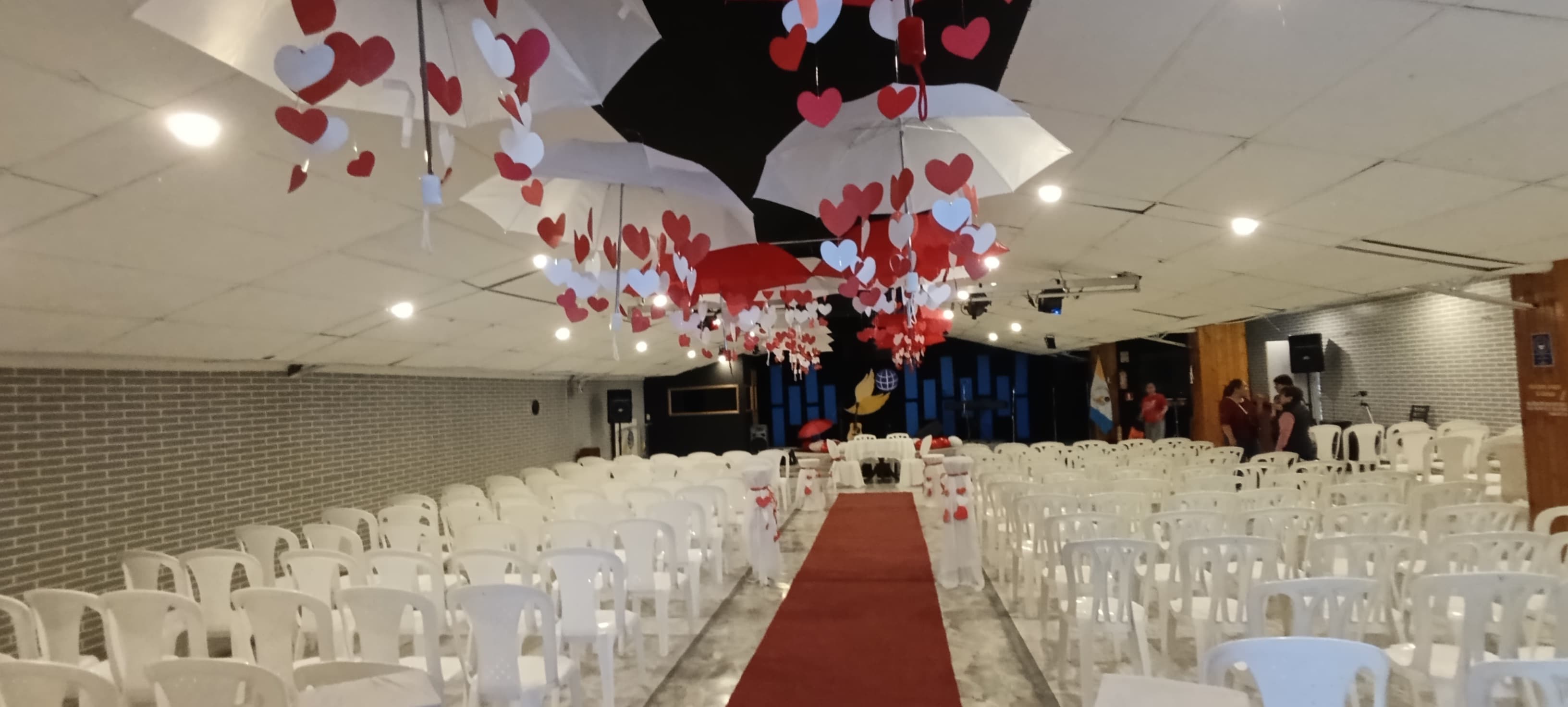 A vibrant church congregation worshiping together with hands raised.